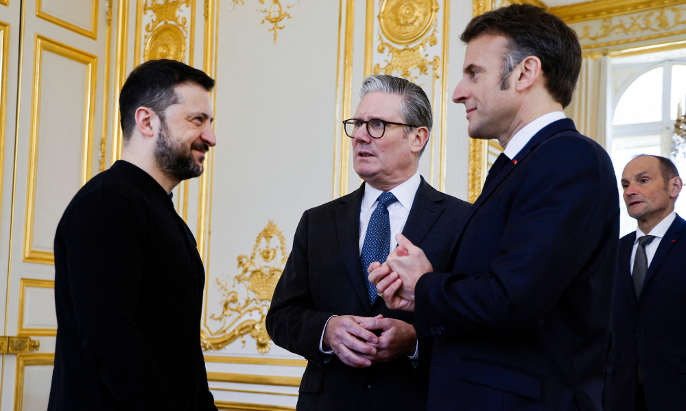 Ukraine's President Volodymyr Zelensky, France's President Emmanuel Macron and Britain's Prime Minister Keir Starmer speak during a trilateral meeting on the sidelines of a summit for "coalition of the willing" at the Elysee Palace, on March 27, 2025. French President Emmanuel Macron on March 27, 2025 is to host European leaders including President Volodymyr Zelensky for a summit aimed at boosting Ukrainian security ahead of any potential ceasefire with Russia.