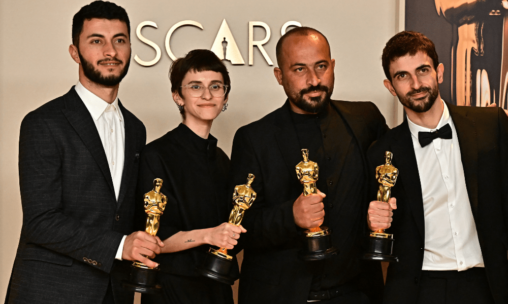 Israeli journalist and filmmaker Yuval Abraham, US producer Rachel Szor, Emirati filmmaker Hamdan Ballal, Palestinian journalist and filmmaker Basel Adra pose in the press room with the Oscar for Best Documentary Feature for "No Other Land" during the 97th Annual Academy Awards at the Dolby Theatre in Hollywood