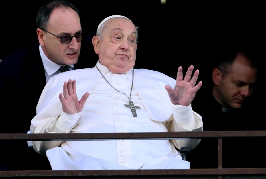 Pope Francis blesses the faithful from the balcony of the Gemelli hospital