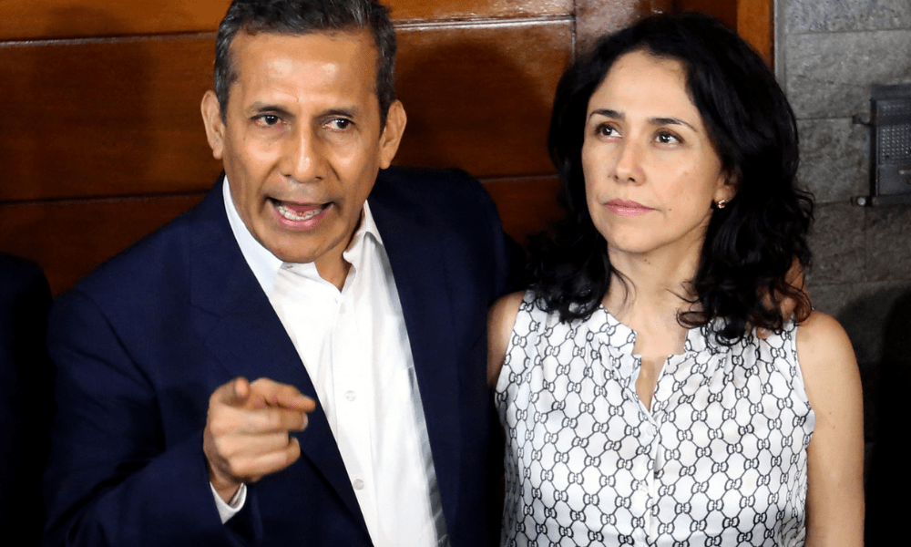 Peru's former President (2011-2016) Ollanta Humala speaks next to his wife Nadine Heredia outside their home after being released from preventative detention awaiting trial on charges of money laundering, in Lima on April 30, 2018. Peruvian former first lady Nadine Heredia, sentenced with her husband to 15 years in prison for money laundering, arrived in Brazil on April 16, 2025, to take up asylum there,